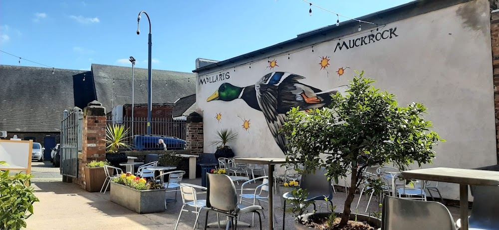Spacious beer garden at Mellards Bar with outdoor seating and greenery